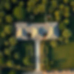 Aerial view of a traditional farmhouse surrounded by lush greenery