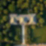 Aerial View of a Traditional Farmhouse Aerial view of a traditional farmhouse surrounded by lush greenery