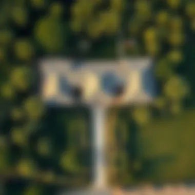 Aerial View of a Traditional Farmhouse Aerial view of a traditional farmhouse surrounded by lush greenery